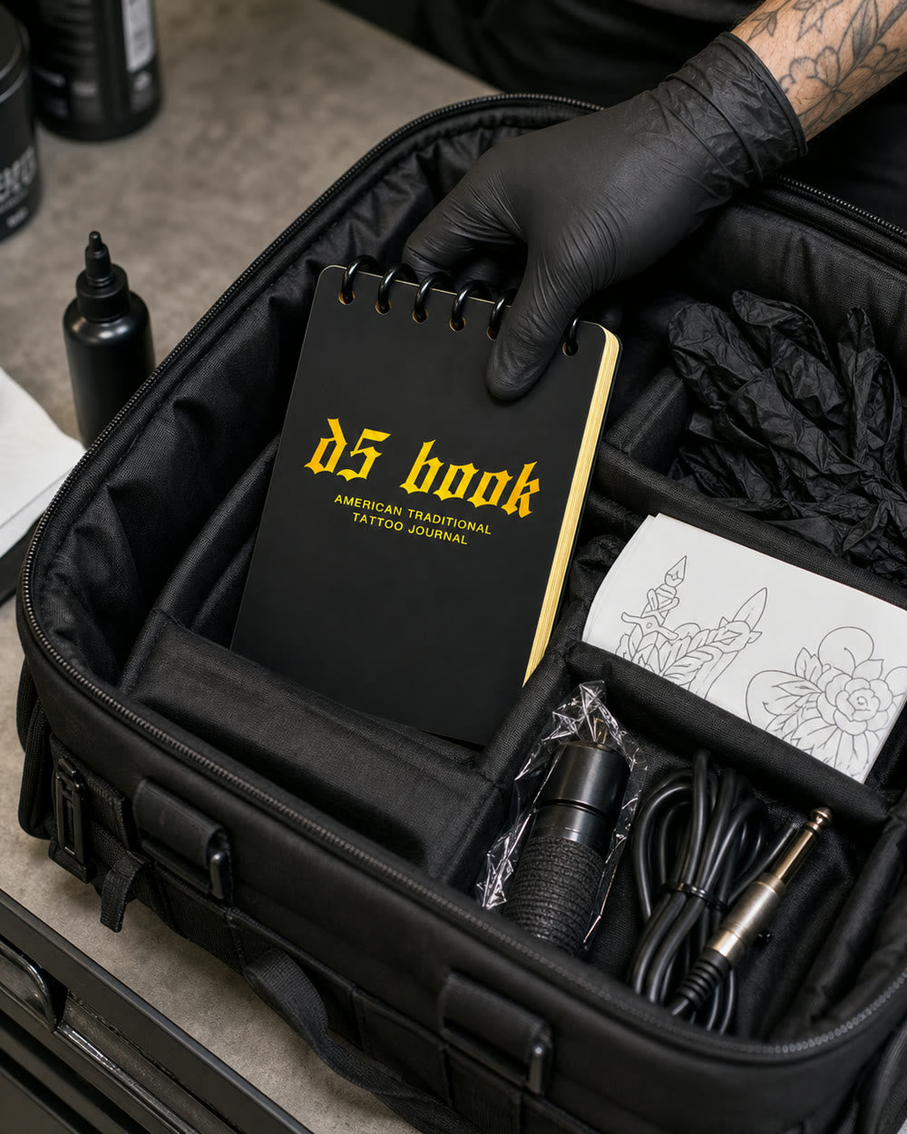D5 practice flipbook packed inside a tattoo artist tool bag